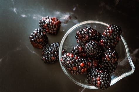 Top View Of A Serving Of Real Blackberries In A Small Clear Bowl On A