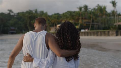 Cute couple walking on the beach Free Stock Video Footage