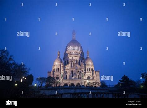 Sacre Coeur Basilica In Montmartre Paris Illuminated During A Winter