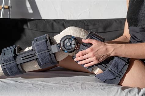 Premium Photo | Female buckling knee orthosis or knee support brace after surgery on leg