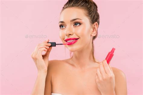 Smiling Naked Beautiful Woman With Pink Lips Applying Lip Gloss