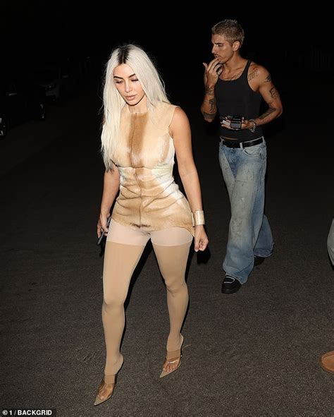 Kim Kardashian Flaunts Her Curvaceous Figure In A Daring Illusion Dress And Quirky Nude Leggings