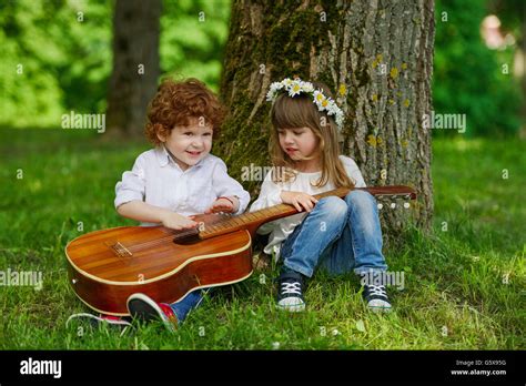 cute children playing guitar Stock Photo - Alamy