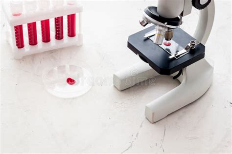 Blood Testing Laboratory Samples Viewing Under Microscope Near Tubes