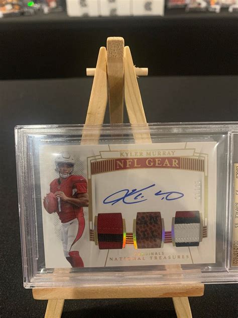 Kyler Murray 2019 National Treasures RC NFL Gear Auto Trios Prime BGS 9