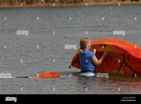 Cute Early Teen Blonde Girl Righting Her Kayak Stock Photo Alamy