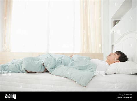 Man Sleeping In Bed Stock Photo Alamy