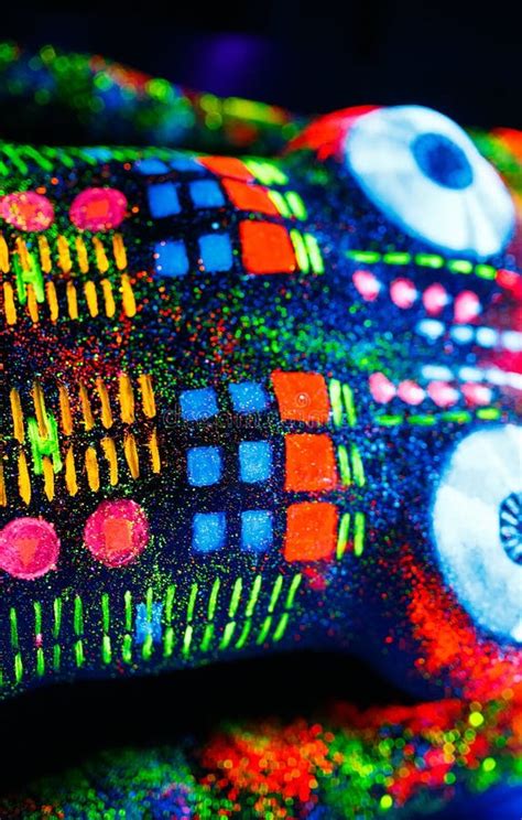 Concept On The Body Of A Girl Painted DJ Deck Half Naked Girl Painted In UV Colors Stock