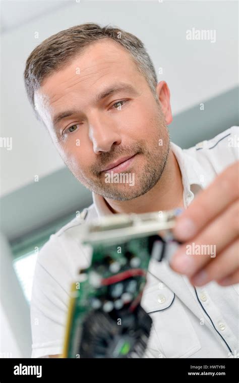 Installing a video card Stock Photo - Alamy