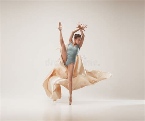 Modern Ballet Dancer Dancing In Full Body On White Studio Background