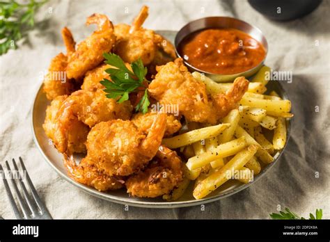 Homemade Deep Fried Coconut Shrimp with Fries and Cocktail Sauce Stock ...