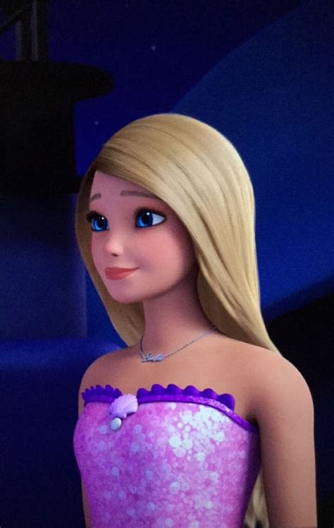 A Barbie Doll With Blonde Hair And Blue Eyes Wearing A Purple Dress In