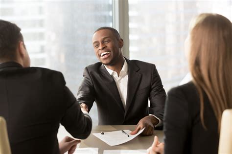 Excited Smiling Black Businessman Handshaking White Partner At