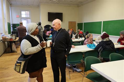 Warm Christmas dinner draws dozens of homeless Omahans - The Catholic Voice