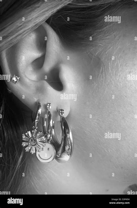 Ear piercing girl Black and White Stock Photos & Images - Alamy