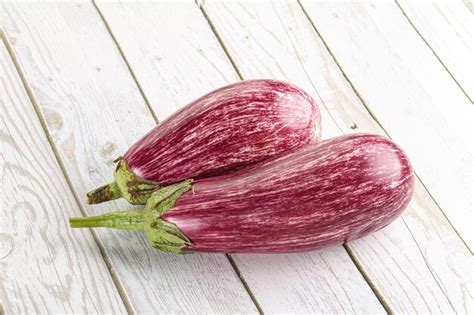 Premium Photo Two Ripe Purple Graffiti Eggplant For Cooking