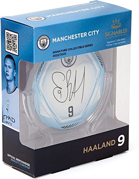 An Autographed Soccer Ball In A Box With The Number Inscribed On It