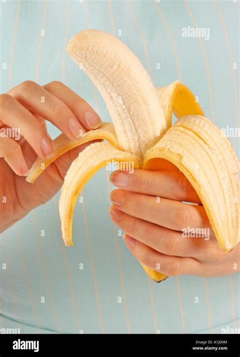 Woman Peeling Banana Stock Photo Alamy