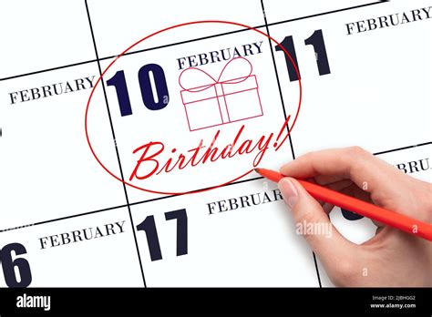 10th day of February. The hand circles the date on the calendar 10 ...