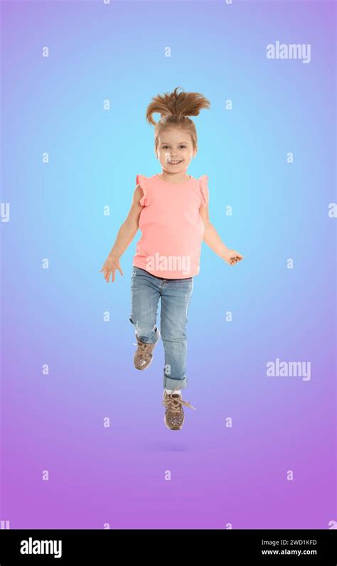 Happy Cute Girl Jumping On Color Gradient Background Stock Photo Alamy