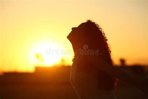 Silhouette Of A Woman Breathing Fresh Air Stock Photo Image Of