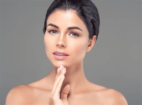 Premium Photo Woman With Clean Fresh Healthy Skin Natural Fashion Nude Make Up Over Gray