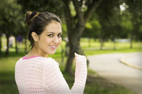 Hispanic Brunette Model In Park Wearing White Top Stock Image Image Of Health Green