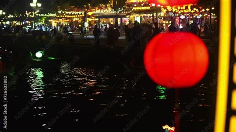 Traditional Chinese Paper Lantern Hanging On Bridge Over Night River In