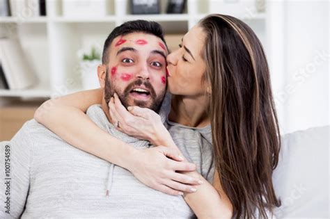 Valentines Couple Woman Kissing Man With Red Lipstick All Over His