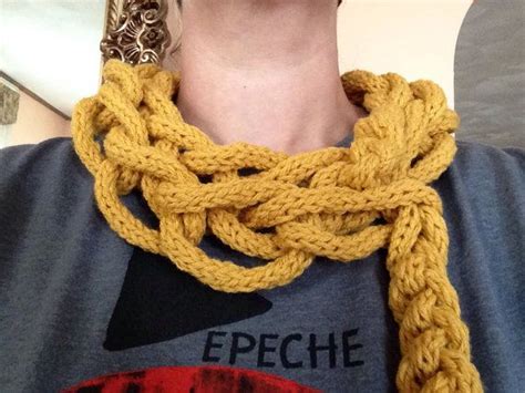 A Woman Wearing A Yellow Knitted Necklace