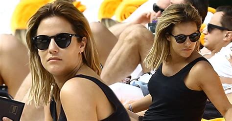 Caroline Flack Accidentally Flashes Her Nipples With Poolside Bikini Change As She Continues