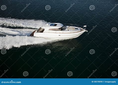 A Fast Motor Boat Sailing Through The Sea Stock Photo Image Of Ship