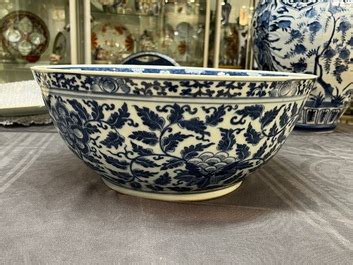 A Large Chinese Blue And White Lotus Scrolls Bowl And Three Famille