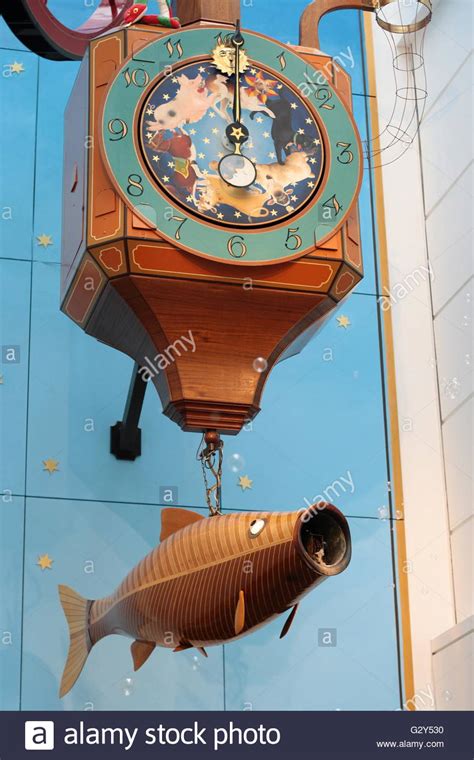 Wishing Fish Clock in Regent Arcade, Cheltenham, UK Stock Photo ...