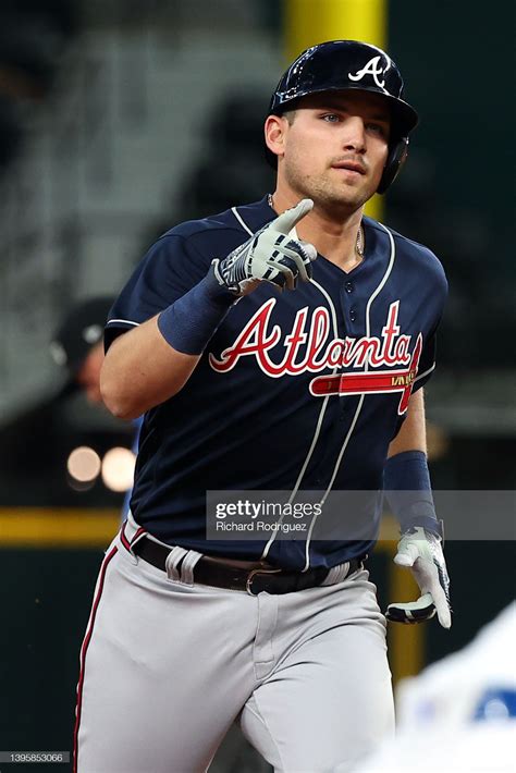 Austin Riley of the Atlanta Braves gestures to his teams dugout after ...