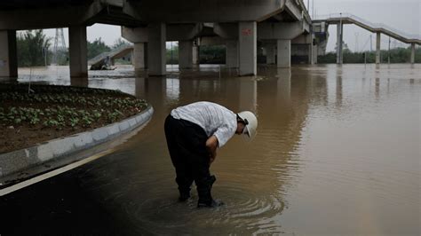 China Floods Four Dead As Cities Submerged After Days Of Record