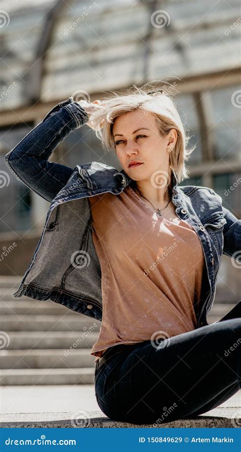 Beautiful Blonde Takes Off Her Glasses Sits On The City Steps Stock Image Image Of Portrait