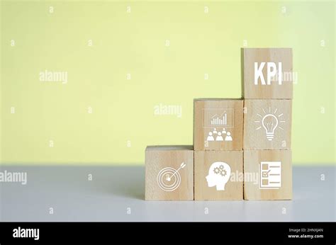 Wooden Cubes With Kpi Key Performance Indicator Symbol On Background