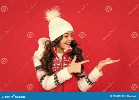 Presenting Copy Space Amazed Kid With Curly Hair In Christmas