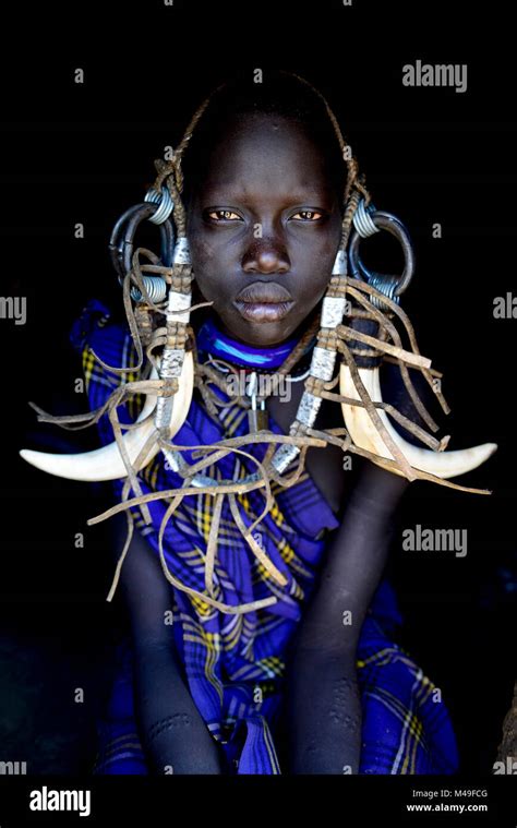 Young Girl In Traditional Dress Mursi Tribe Mago National Park Omo