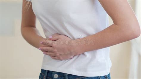 Woman Suffering From Abdominal Pain At Home Stock Footage Video Of