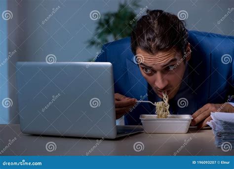 Hungry Employee Working Late In The Office Stock Image Image Of