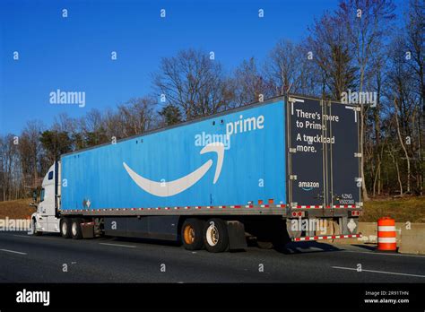 BALTIMORE, MD -30 MAR 2023- View of a blue Amazon Prime delivery tractor trailer truck on a ...