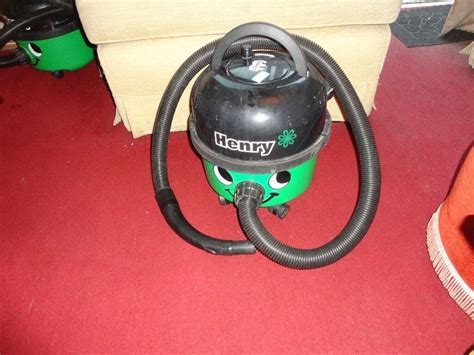 green and black henry hoover with pipe in good working order | in ...