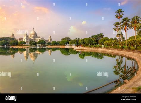 Scenic Victoria Memorial Kolkata At Sunrise With Water Reflection Stock