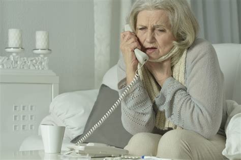 Premium Photo Portrait Of A Sick Mature Woman Calling Doctor