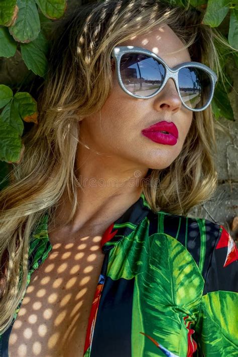 Hot Blonde Brazilian Model Posing Outdoors Against A Field Of Plants Stock Photo Image Of