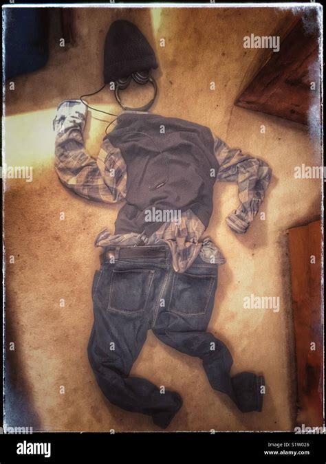 Discarded clothes on bedroom floor Stock Photo - Alamy