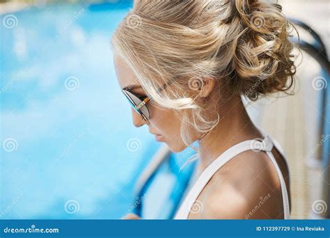 Portrait Of Beautiful And Fashionable Blonde Model Girl In Sunglasses