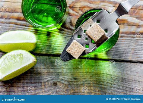 Absinthe With Sugar Cubes In Spoon On Wooden Background Top View Stock